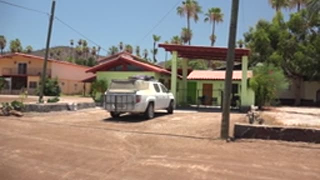 MULEGE BCS MEXICO-2022: Panning View of Residential Area with Parked Truck