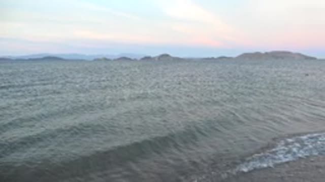 BAHIA DE LOS ANGELES BCS MEXICO-2022: Gentle Ocean Waves Lapping at Sandy Shore at Dusk