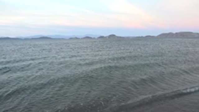 BAHIA DE LOS ANGELES BCS MEXICO-2022: Gentle Ocean Waves Approaching the Sandy Shore