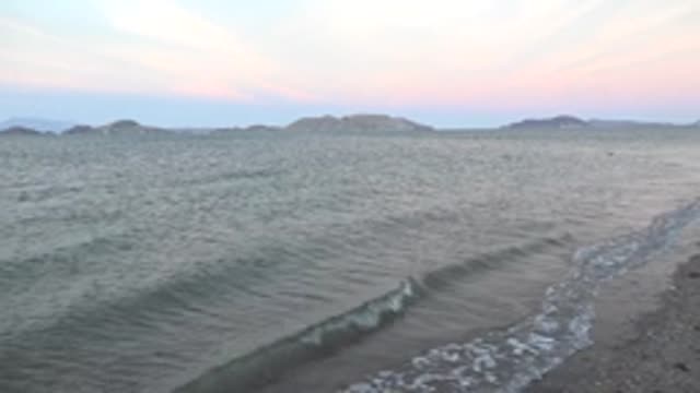 BAHIA DE LOS ANGELES BCS MEXICO-2022: Gentle Ocean Waves Lapping Sandy Beach at Dusk