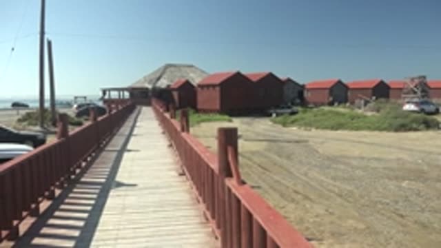 LA BOCANA BCS MEXICO-2022: Wooden Boardwalk with Shifting Vehicles in Parking Area