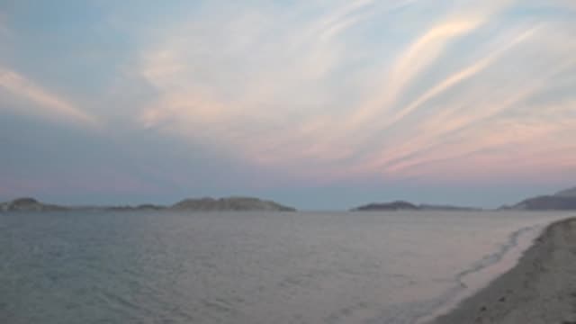 BAHIA DE LOS ANGELES BCS MEXICO-2022: Gentle Pan Along Beach with Distant Islands and Calm Ocean
