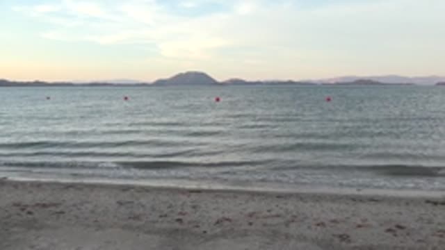 BAHIA DE LOS ANGELES BCS MEXICO-2022: Gentle Ocean Waves Rolling Onto Sandy Shore