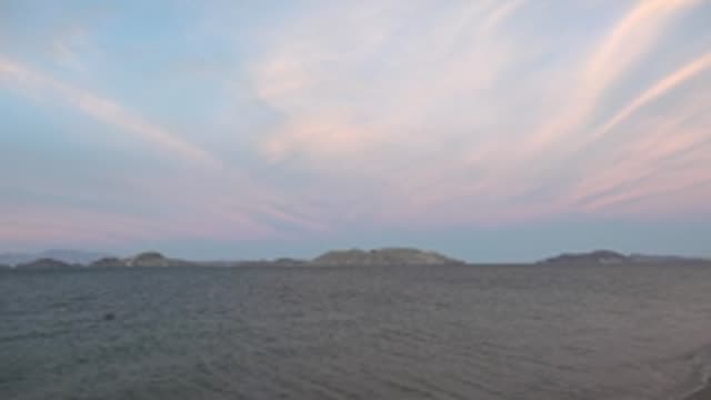 BAHIA DE LOS ANGELES BCS MEXICO-2022: Calm Ocean and Distant Islands Under Pink-Blue Sky
