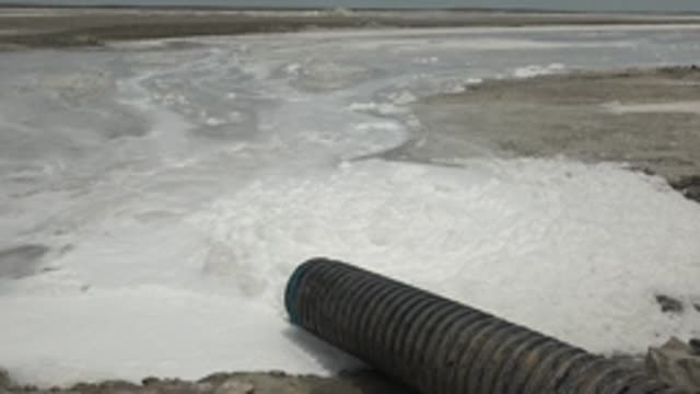 GUERRERO NEGRO BCS MEXICO-2022: Industrial Hose Releasing Foamy White Substance
