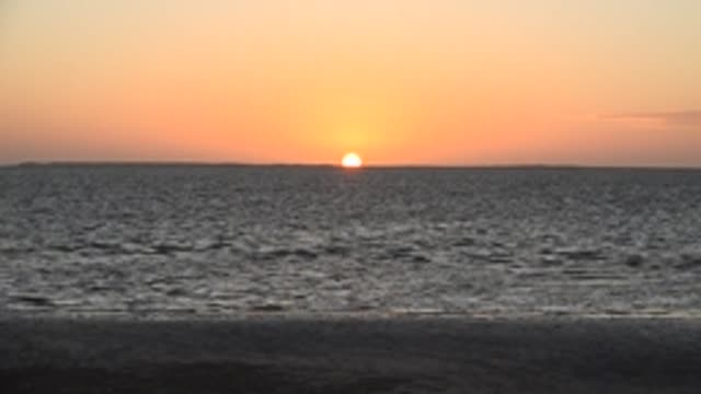 SAN CARLOS BCS MEXICO-2022: Sunset over Calm Ocean with Gentle Waves