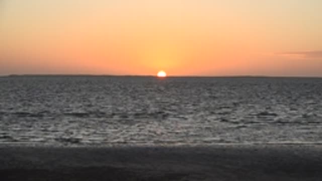 SAN CARLOS BCS MEXICO-2022: Sunset over Calm Ocean with Gentle Waves