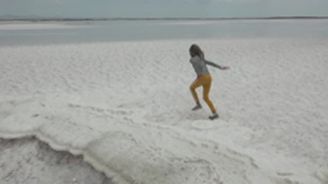 GUERRERO NEGRO BCS MEXICO-2022: Person Running Across White Salt Flat