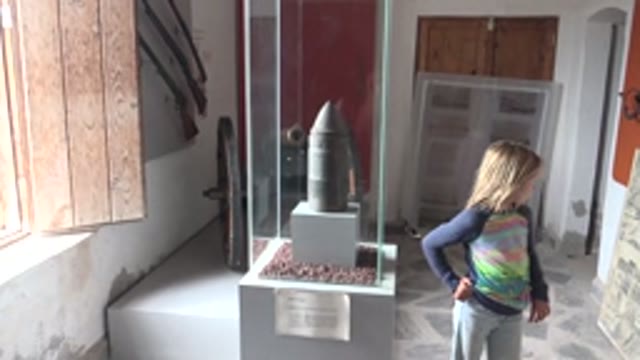 MULEGE BCS MEXICO-2022: Girl Observing Museum Artifact Then Walking Away