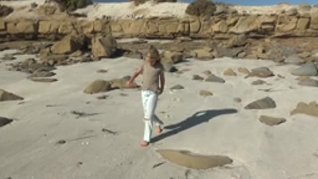 LA BOCANA BCS MEXICO-2022: Child Running on Sandy Beach with Rocks