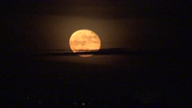 LA BOCANA BCS MEXICO-2022: Rising Full Moon Behind Dark Mountain Silhouette