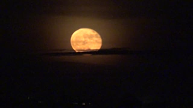 LA BOCANA BCS MEXICO-2022: Full Moon Rising Over Dark Silhouetted Landscape