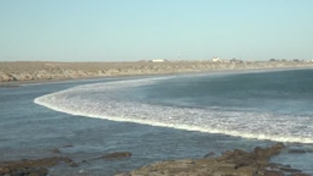 LA BOCANA BCS MEXICO-2022: Gentle Ocean Waves Rolling Onto Rocky Shore