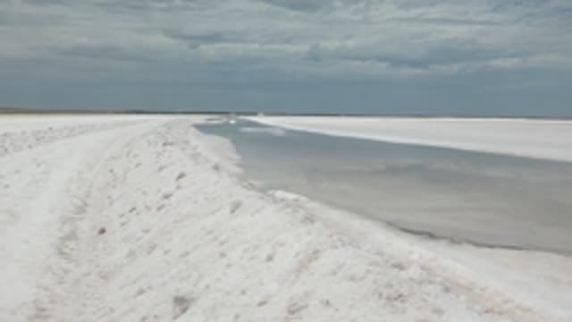 GUERRERO NEGRO BCS MEXICO-2022: Person Walking Along Snow-covered Frozen Path
