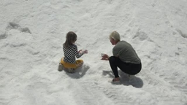 GUERRERO NEGRO BCS MEXICO-2022: Child and Adult Interacting in Snowy Field