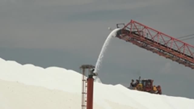 GUERRERO NEGRO BCS MEXICO-2022: Conveyor Belt Unloading Salt Onto a Pile