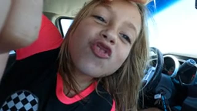 BAJA CALIFORNIA MEXICO-2022: Child Making Playful Faces in Car