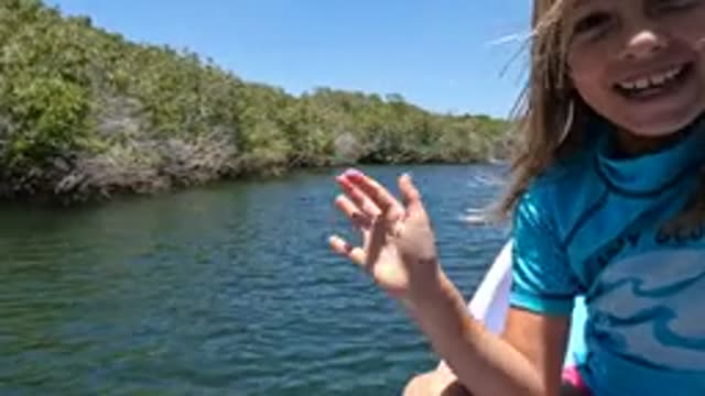 BAJA CALIFORNIA MEXICO-2022: Child Waving From a River Boat