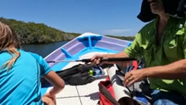 BAJA CALIFORNIA MEXICO-2022: Girl Takes Fishing Rod From Man on Boat