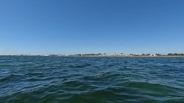 BAJA CALIFORNIA MEXICO-2022: Ocean Waves with Distant Shoreline View