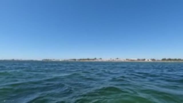BAJA CALIFORNIA MEXICO-2022: Gentle Ocean Waves Under Clear Blue Sky
