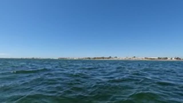 BAJA CALIFORNIA MEXICO-2022: Gentle Ocean Waves with Distant Shoreline