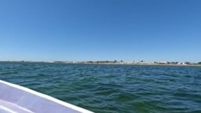 BAJA CALIFORNIA MEXICO-2022: Boat View of Calm Ocean and Distant Shoreline
