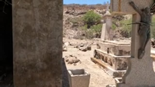BAJA CALIFORNIA MEXICO-2022: Arid Cemetery with Tombstones and Mausoleum
