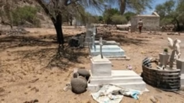 BAJA CALIFORNIA MEXICO-2022: Person Walking Through a Desert Cemetery