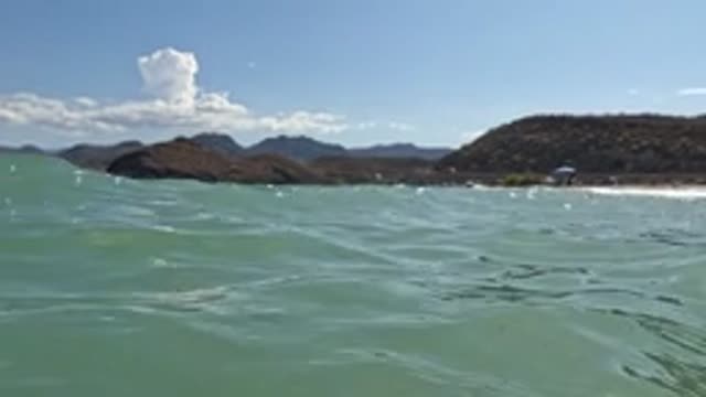 BAJA CALIFORNIA MEXICO-2022: Gentle Ocean Waves Near Coastal Beach