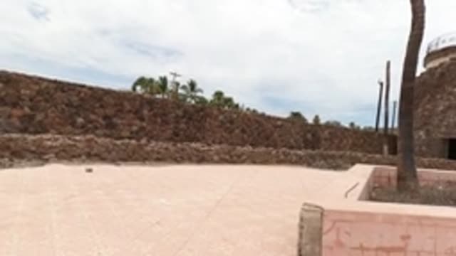 BAJA CALIFORNIA MEXICO-2022: Panning View of Stone-walled Courtyard and Tower