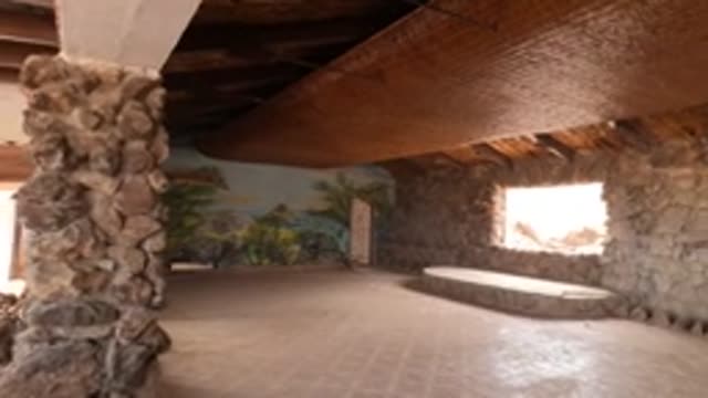 BAJA CALIFORNIA MEXICO-2022: Panning View of Stone-Walled Room with Thatched Ceiling