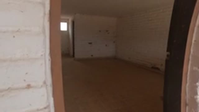 BAJA CALIFORNIA MEXICO-2022: Camera Entering Empty White Brick Room