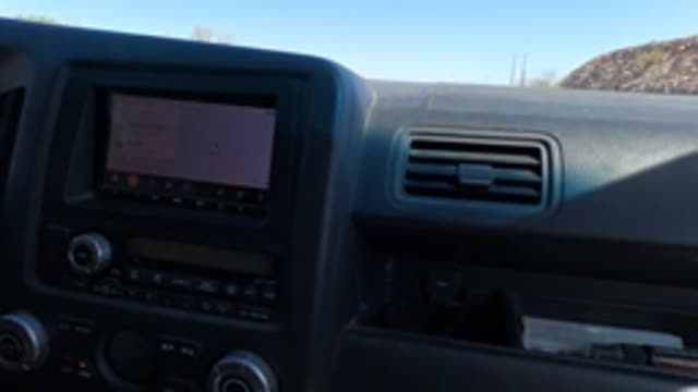 BAJA CALIFORNIA MEXICO-2022: Car Dashboard with GPS and Moving Desert Scenery