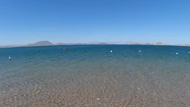 BAJA CALIFORNIA MEXICO-2022: People Swimming in Shallow Coastal Waters