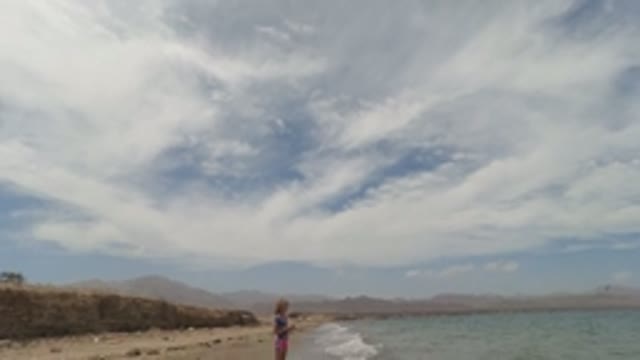 BAJA CALIFORNIA MEXICO-2022: Child on a Sandy Beach with Mountain and Sea View