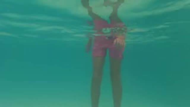 BAJA CALIFORNIA MEXICO-2022: Girl Submerging and Swimming in Pool