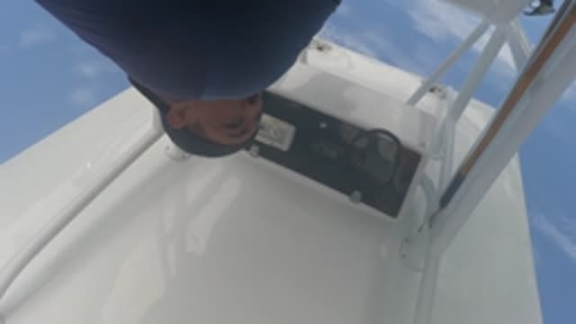BAJA CALIFORNIA MEXICO-2022: Person Adjusting Boat Control Panel on Deck