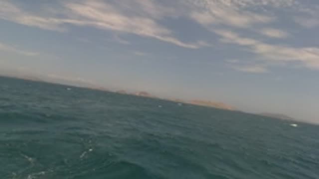 BAJA CALIFORNIA MEXICO-2022: Boat View of Ocean Waves and Distant Islands