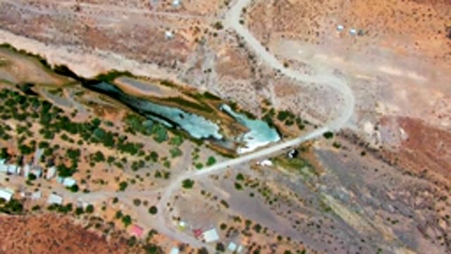 SAN JUANICO BCS MEXICO-2022: Winding Road Through Arid Terrain with Shallow Water