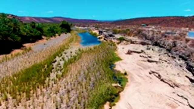 SAN JUANICO BCS MEXICO-2022: River Flowing Through Arid and Cultivated Terrain