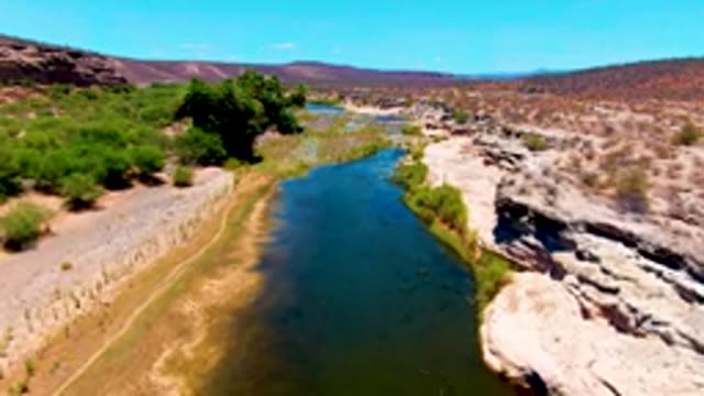 SAN JUANICO BCS MEXICO-2022: River Flowing Through Arid Rocky Landscape
