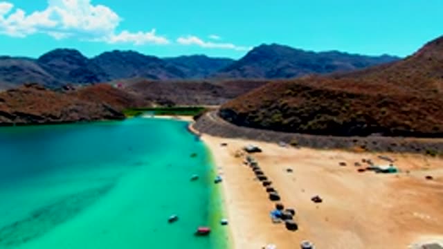 PLAYA SANTISPAC BCS MEXICO-2022: Beach with Boats and Vehicles in Motion