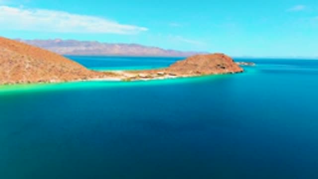 PLAYA SANTISPAC BCS MEXICO-2022: Coastal Shoreline with Shifting Turquoise Waters and Rocky Hills