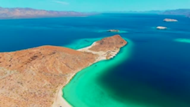 PLAYA SANTISPAC BCS MEXICO-2022: Desert Coastline with Turquoise Waters and Distant Islands