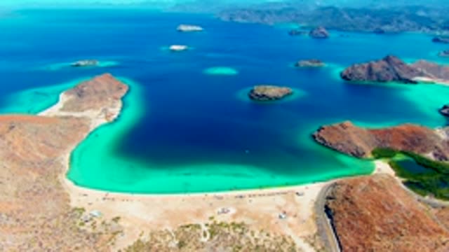 PLAYA SANTISPAC BCS MEXICO-2022: Sandy Beach and Turquoise Bay with Rocky Islands
