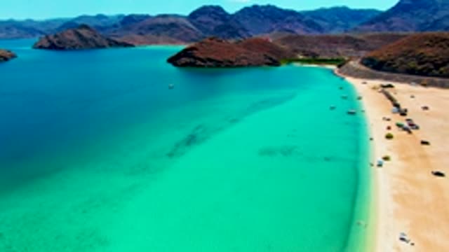 PLAYA SANTISPAC BCS MEXICO-2022: Vehicles and People Moving on Sandy Beach