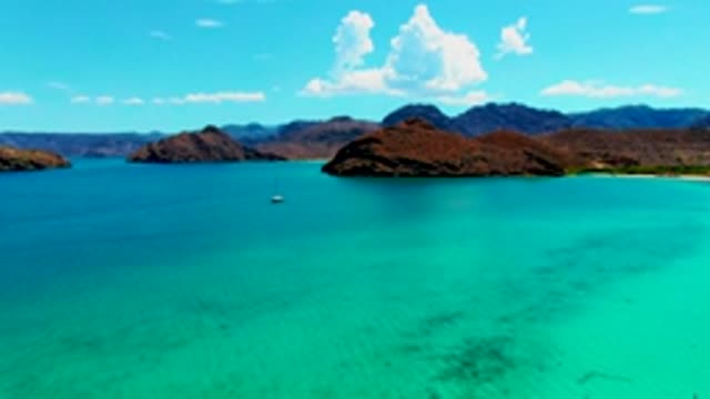 PLAYA SANTISPAC BCS MEXICO-2022: Sailboat Drifting in Turquoise Coastal Waters