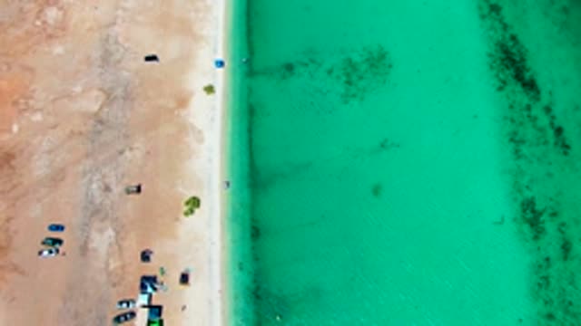 PLAYA SANTISPAC BCS MEXICO-2022: Beachgoers and Vehicles Departing Sandy Shore
