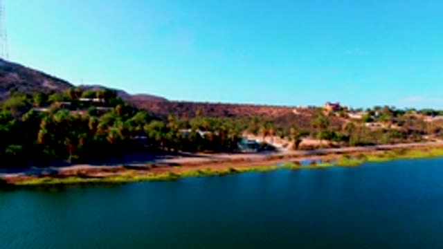MULEGE BCS MEXICO-2022: Aerial Panning View of Reservoir Shore and Hillside